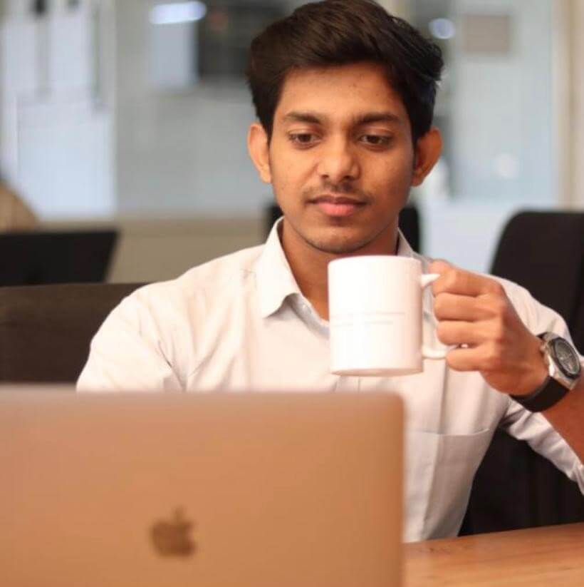 (Akshay enjoying work while having coffee)